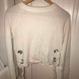 Cropped sweater with lace up sides